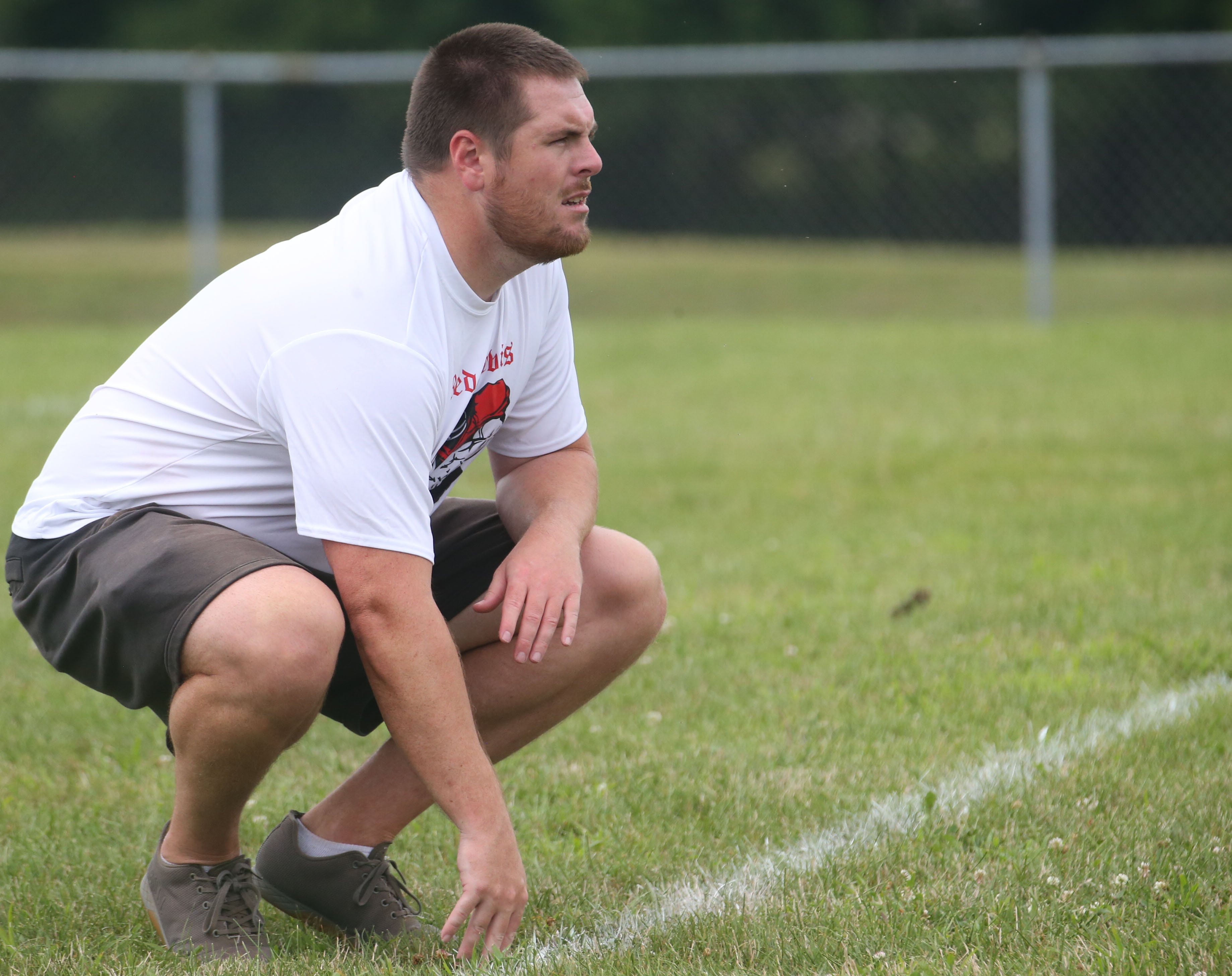 Hall football head coach Logan Larson watches his team run drills during the first day of practice on Monday, Aug. 12, 2024 at Hall High School.