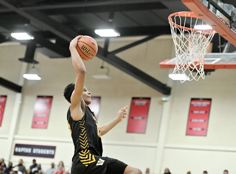 Joliet West's Zion Gross soars for a dunk during the Class 4A sectional semifinal against Homewood Flossmoor at Rich Township on Tuesday, Feb. 27, 2024, at Richton Park. (Dean Reid for Shaw Local News Network)