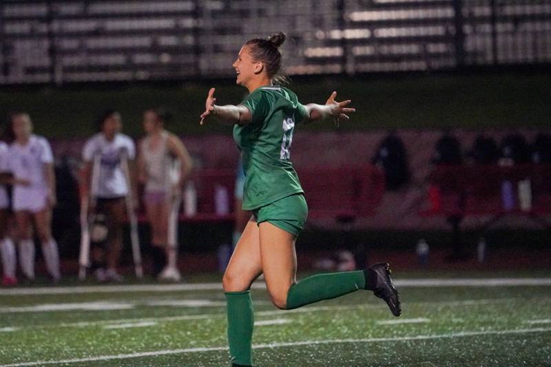 York’s Cate Carter (12) smiles after scoring the winning goal off of a penalty kick during a Class 3A Hinsdale Central Sectional semifinal soccer match against Downers Grove North at Hinsdale Central High School in Hinsdale on Tuesday, May 21, 2024.