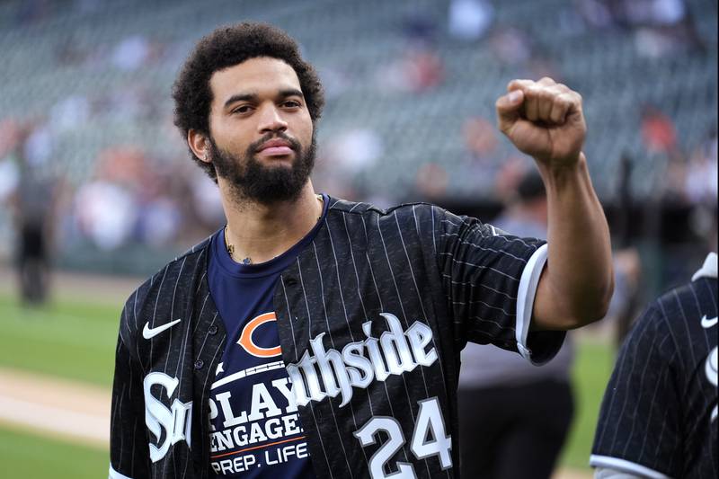 Quarterback Caleb Williams, a Chicago Bears first-round draft pick, acknowledges the crowd before a baseball game between the Chicago White Sox and the Baltimore Orioles on Thursday, May 23, 2024, in Chicago. (AP Photo/Charles Rex Arbogast)