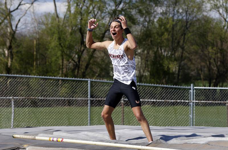 McHenry’s Zachary Galvicius celebrates as he clears 15 feet 4 inches to set a new record in the pole vaults Friday, April 21, 2023, during the McHenry County Track and Field Meet at Cary-Grove High School.