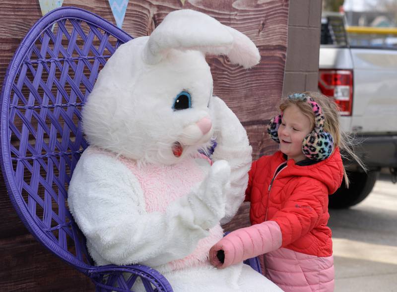 Reagan Marks of LaGrange hugs the Easter Bunny during the LaGrange Easter Egg Hunt Saturday, March 23, 2024.