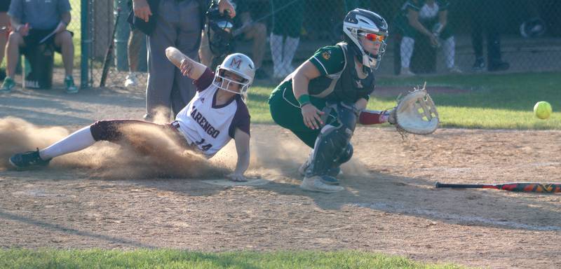 Marengo’s Kylee Jensen slides safely into home against North Boone in IHSA Softball Class 2A Regional Championship action at Marengo Friday.