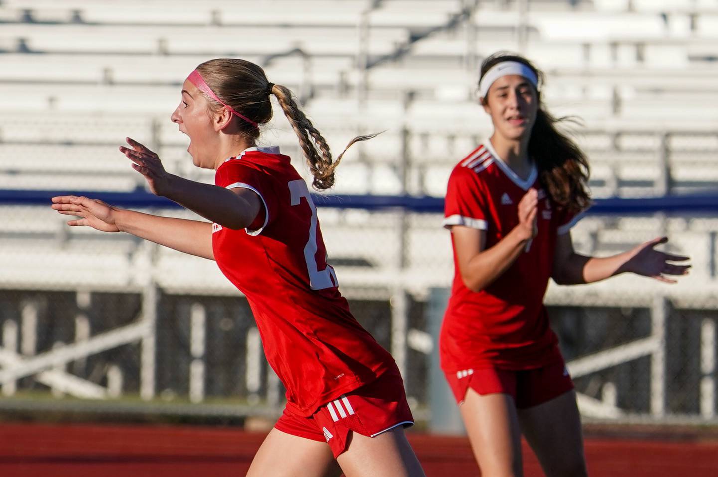 Naperville Central's Nicole Sacek (22) reacts after scoring a goal against St. Charles North during a Class 3A St. Charles North Supersectional soccer final match at St. Charles North High School on Tuesday, May 28, 2024.