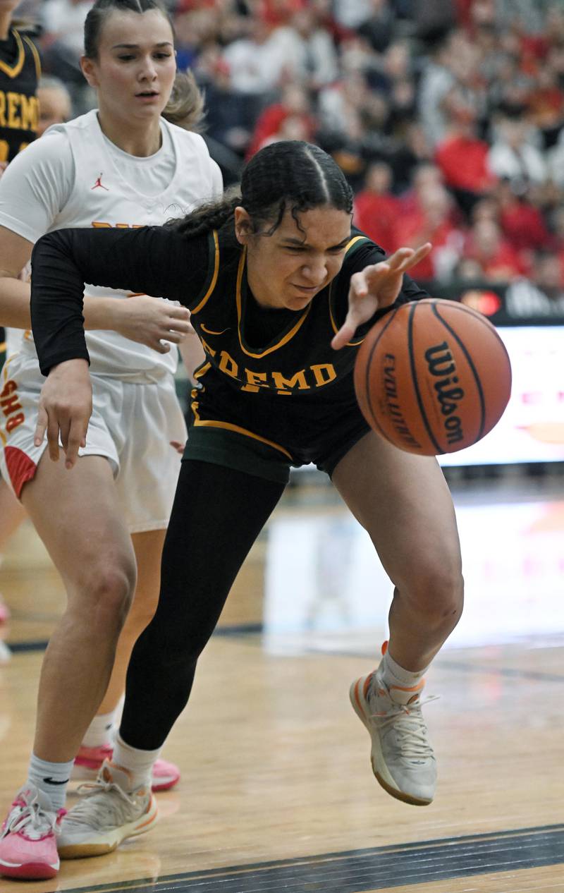 Fremd’s Coco Urlacher fights for the ball as Batavia’s Brooke Carlson watches in the Bartlett supersectional game on Monday, Feb. 26, 2024.