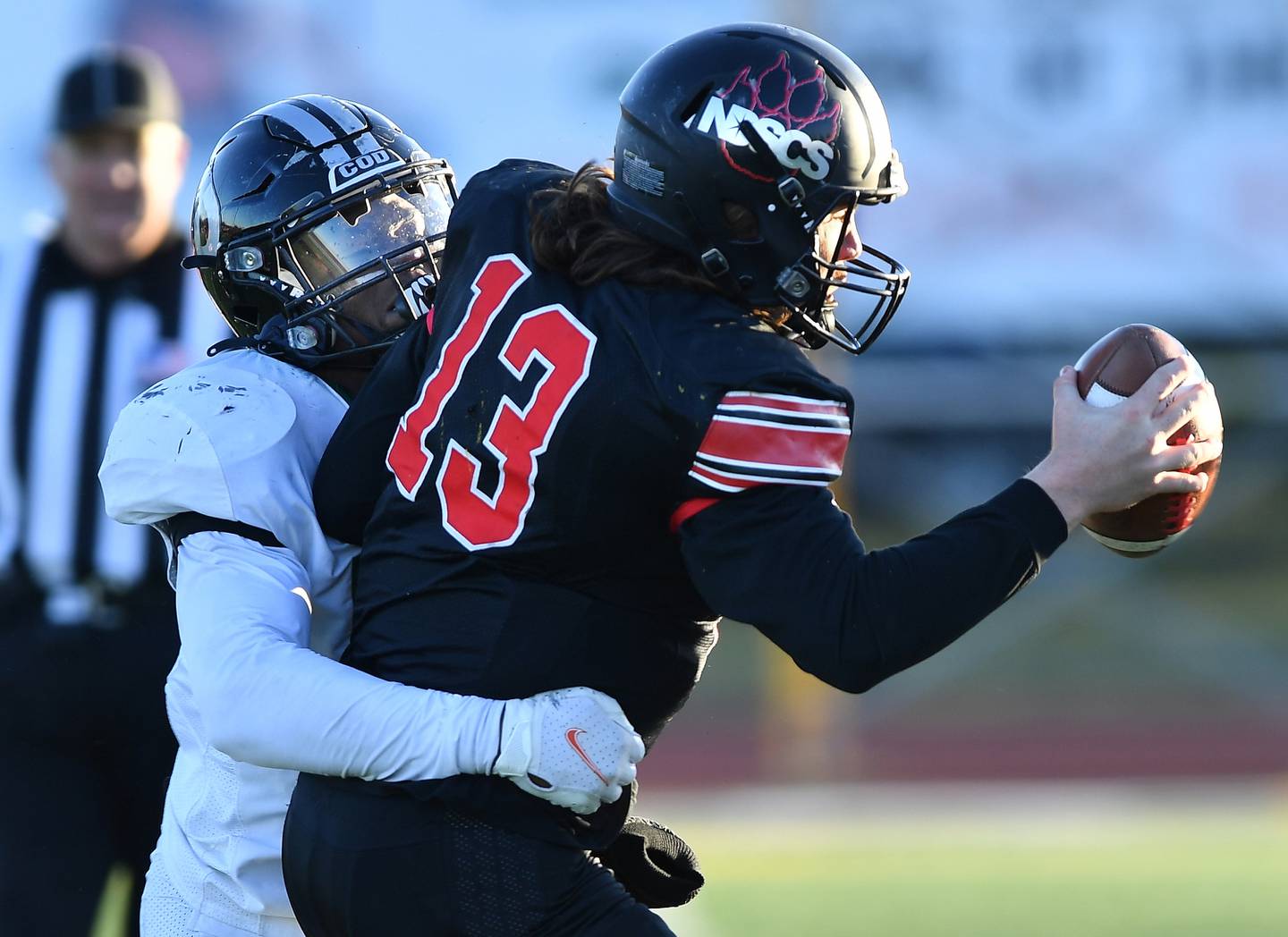 College of Dupage's Byron Puryear sacks North Dakota State College of Science quarterback Graedyn Buell (13) to end the NJCAA DIII National Championship game on Dec. 3, 2022 at College of Dupage in Glen Ellyn.