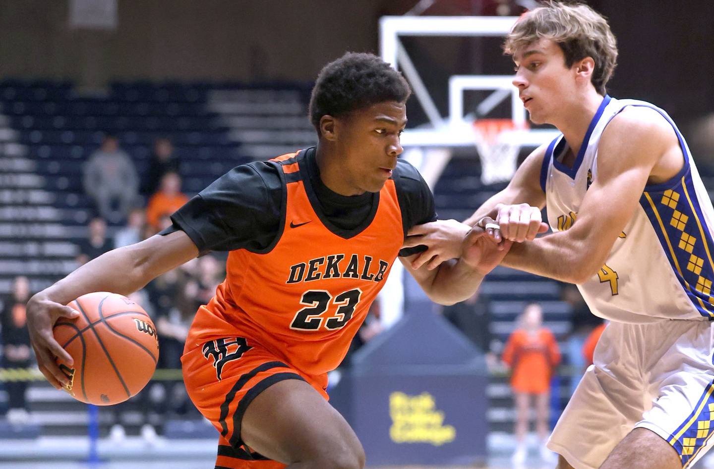 DeKalb’s Davon Grant looks to go baseline against Warren's Jack Wolf Tuesday, Feb. 27, 2024, during their Class 4A sectional semifinal game at Rock Valley College in Rockford.