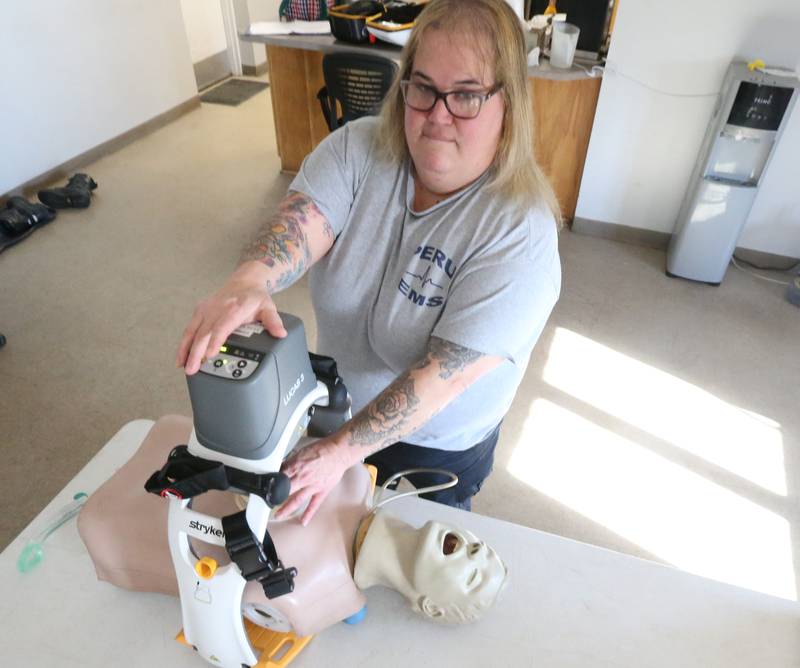 Peru paramedic Bonnie Hartman uses a mechanical chest compression device known as Lucas 3 made by Strkyer on a mannequin on Tuesday, Jan. 10, 2023 at Peru EMS. The decice maintains chest compressions hands free during transport to advanced lifesaving therapies. It's unknown if the device was used to save Buffalo Bills safety Damar Hamlin, but CPR was administered on the field for over nine minutes.