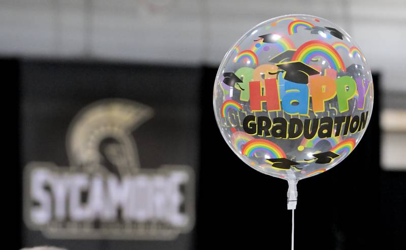 A “Happy Graduation” balloon floats over the crowd before the 2024 Sycamore High School commencement in Sycamore on Sunday, May 26, 2024.