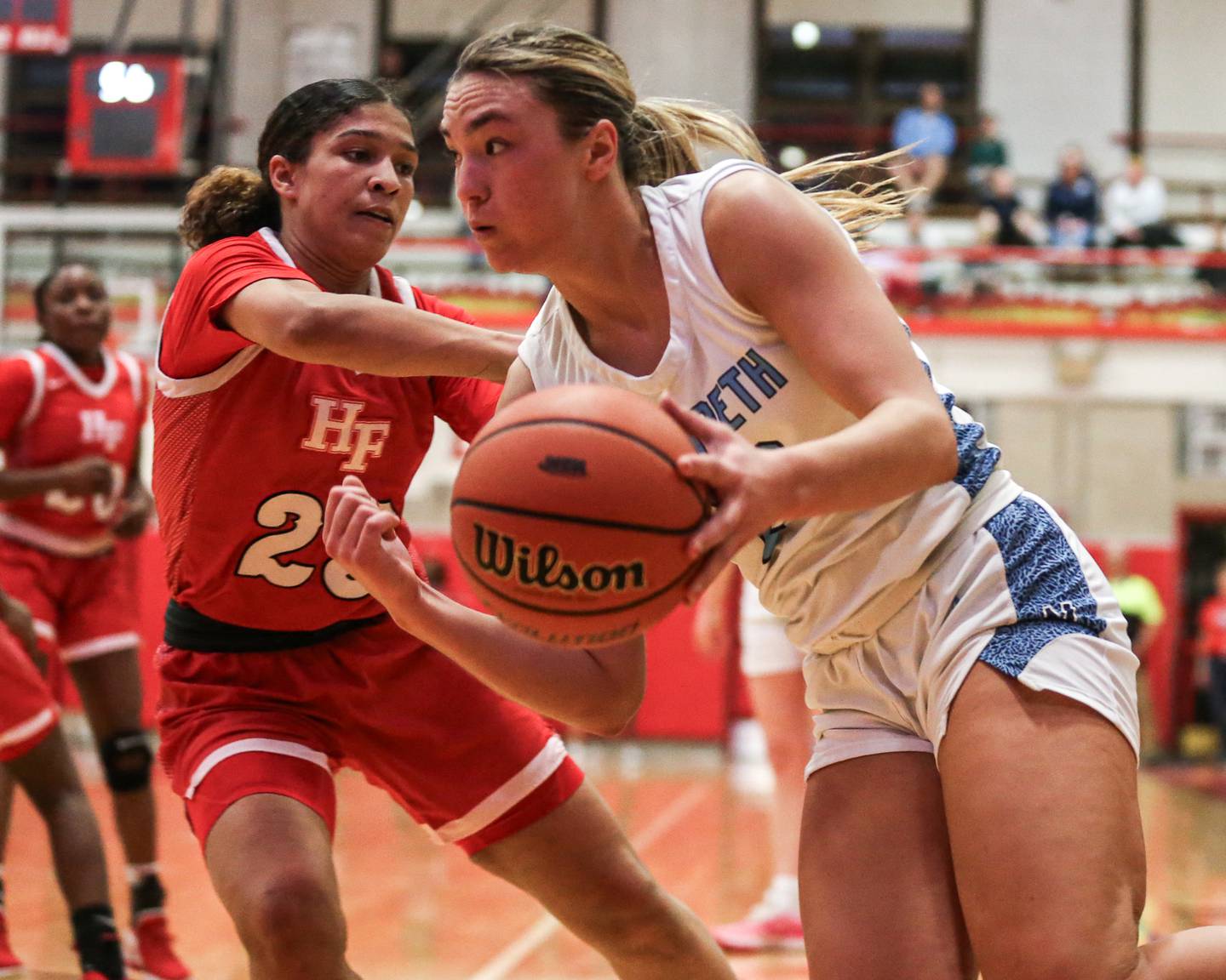 Nazareth's Olivia Austin (21) drives baseline during Class 4A girls supersectional basketball game between Homewood-Flossmoor at Nazareth. Feb 26, 2024.