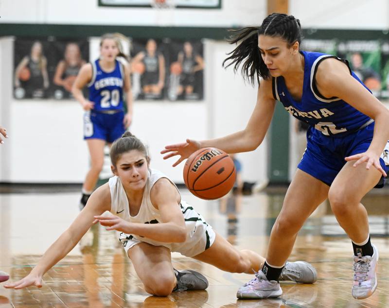 Geneva’s Leah Palmer keeps control of the ball in front of Glenbard West’s Ellie Noble during the Glenbard West Class 4A girls basketball regional final on Thursday, Feb. 15, 2024 in Glen Ellyn.