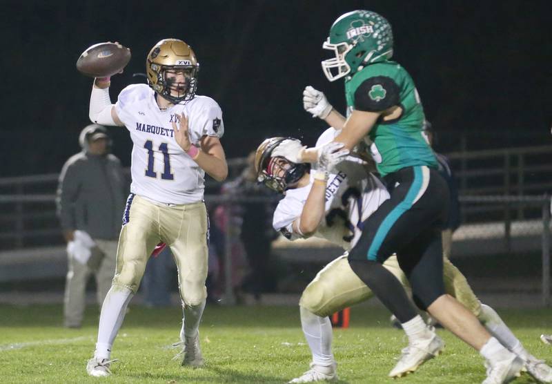 Marquette quarterback Anthony Couch looks to throw as teammate Grant Dose blocks Seneca's Cameron Shriey on Friday, Oct. 18, 2024 at Seneca High School.