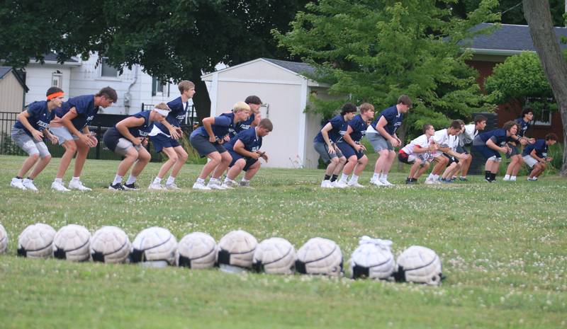 Members of the Fieldcrest football team work on drills on Monday, July 8, 2024 at Fieldcrest High School.