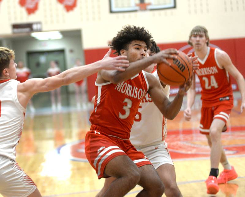 Morrison's DaeShaun McQueen (3) drives through the Oregon defense during 2A regional action on Monday, Feb. 19, 2024 at the Blackhawk Center in Oregon. The Mustangs downed the Hawks 59-52 to advance to the Prophetstown Regional on Wednesday, Feb. 21.