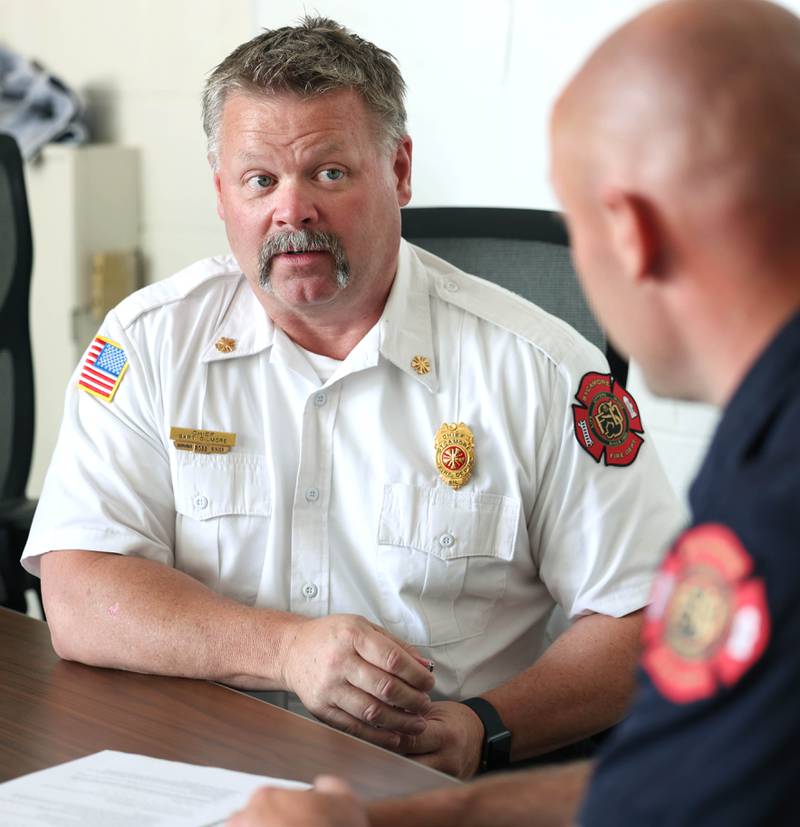 Sycamore Fire Chief Bart Gilmore (left) talks to Ian Wheeler, a firefighter/paramedic with the department, Tuesday, June 11, 2024, at Sycamore Fire Station 1.