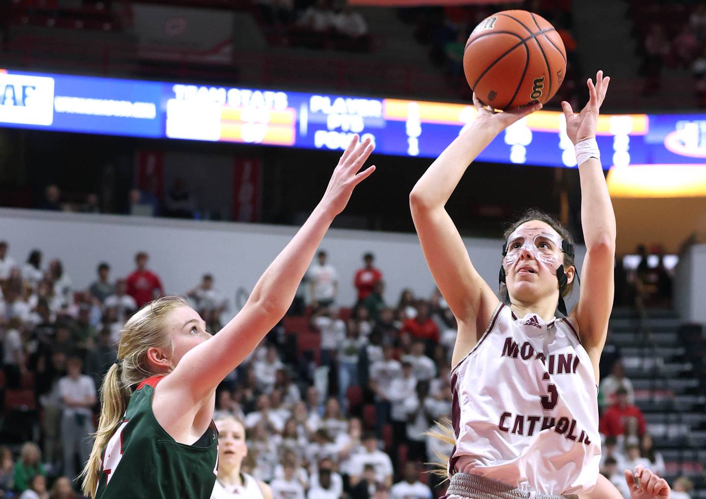 Montini's Nicolette Kerstein shoots over Lincoln's Jenna Bowman during their game Friday, March 1, 2024, in the IHSA Class 3A state semifinal at the CEFCU Arena at Illinois State University in Normal.