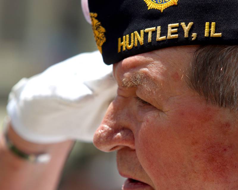 Patrick Conley of Huntley American Legion Post 673 salutes during the playing of taps as part of the Huntley Memorial Day parade and observance Monday. Conley served in the US Navy from 1961-1965.