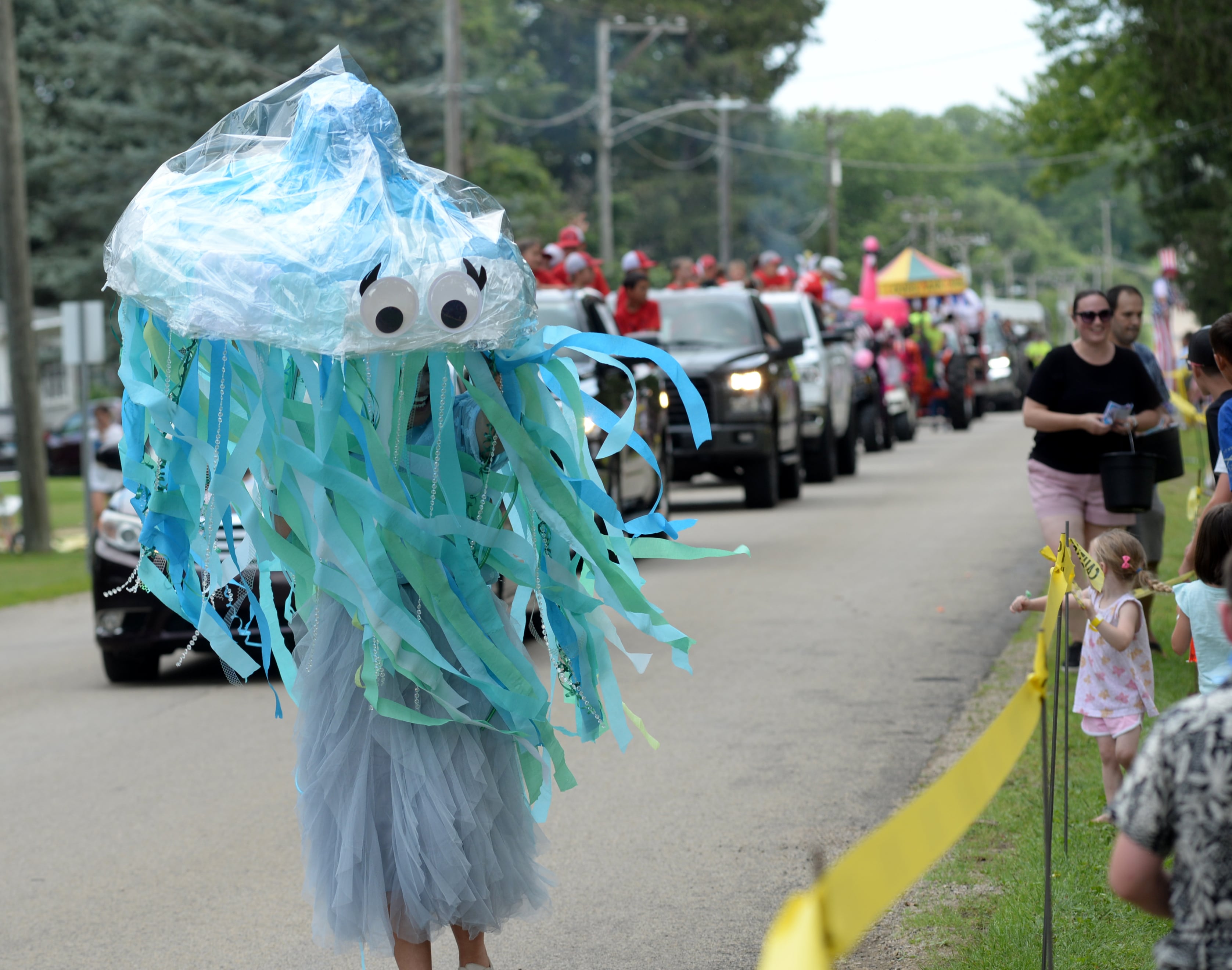 A jellyfish talks to the crowd as it walks with the Silver Creek Reformed Church float during the German Valley Days parade on Saturday, July 20, 2024