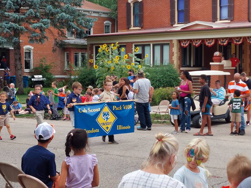 The Cub Scout Pack 4108 of Mendota participates in the Sweet Corn Festival parade Sunday, Aug. 13, 2023.