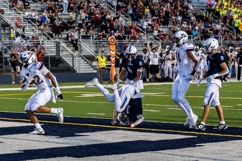 Plainfield North's Malik Jassim scores a touchdown against Plainfield South on Sept. 13, 2024.