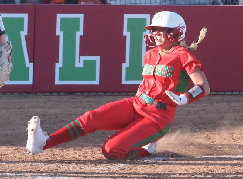 L-P's Karmen Piano scores the teams first run against Kewanee on Monday, March 11, 2024 at the L-P Athletic Complex in La Salle.