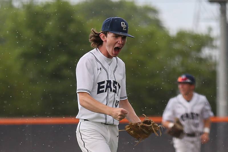 Oswego East's Patrick Flynn (12) celebrates at the end of an inning during Class 4A Romeoville Sectional semifinal between Oswego East at Downers Grove North.  May 31, 2023.