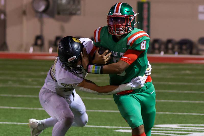 Marion Perich of L-P pushes Landon Egler of Sycamore on Friday, October 11, 2024 at Howard Fellows Stadium in LaSalle.