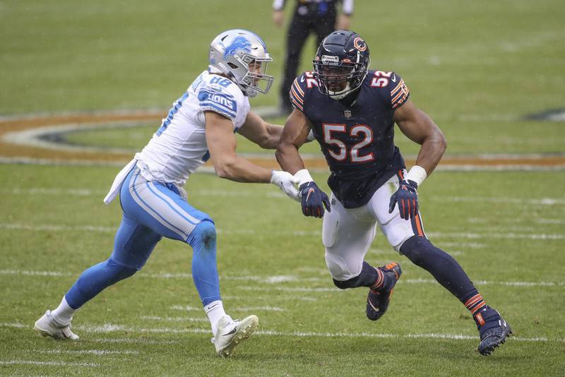 Detroit Lions tight end T.J. Hockenson (left) blocks Bears outside linebacker Khalil Mack in the first half Sunday at Soldier Field. Mack had no sacks or tackles in the game.