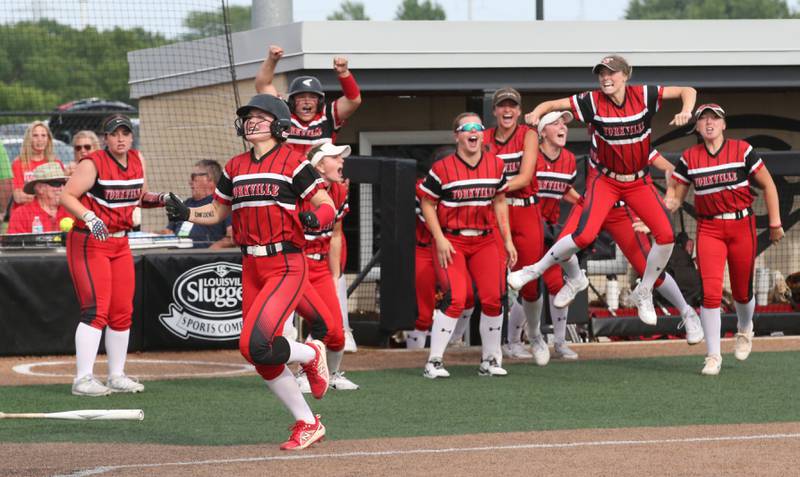 Members of the Yorkville softball team react while pouring out of the dugout after defeating Oak Park-River Forest in thirteen innings during the Class 4A State semifinal softball game on Friday, June 9, 2023 at the Louisville Slugger Sports Complex in Peoria.