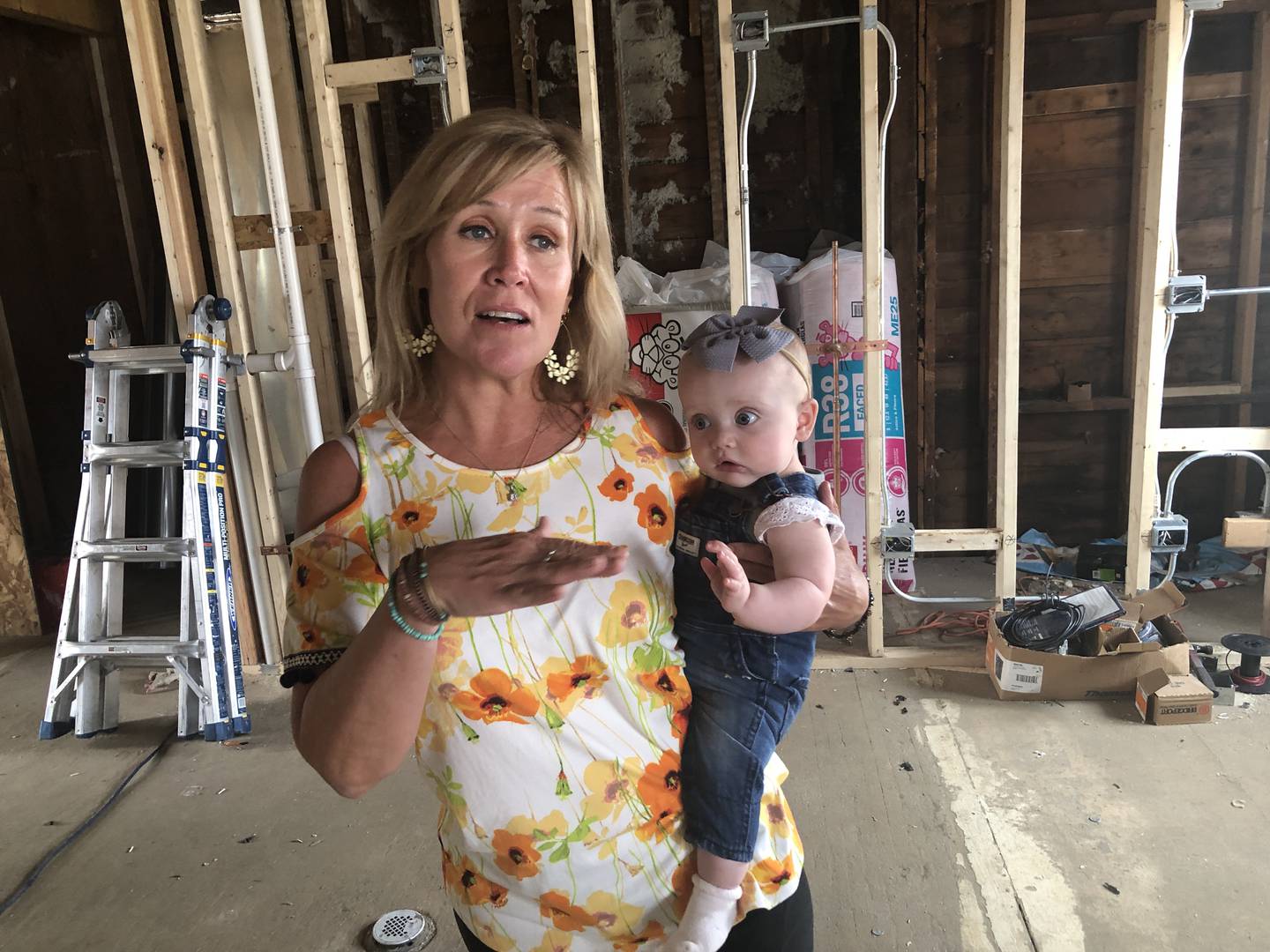 Cathy Levatino, withgranddaughter, Reagan on June 27, 2023, in downtown McHenry. Cathy Levatino is renovating the former insurance office as the new Rita's Italian Ice and Custard, set to open later this summer