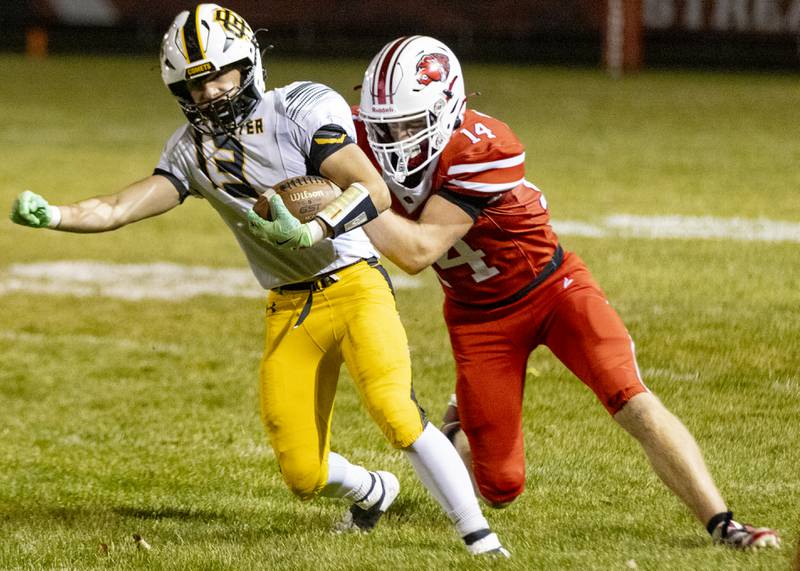 Streator's William Martin (14) attempts to tackle Reed-Custer's Brady Tyree (13) Oct. 18, 2024, at Doug Dieken Field in Streator.