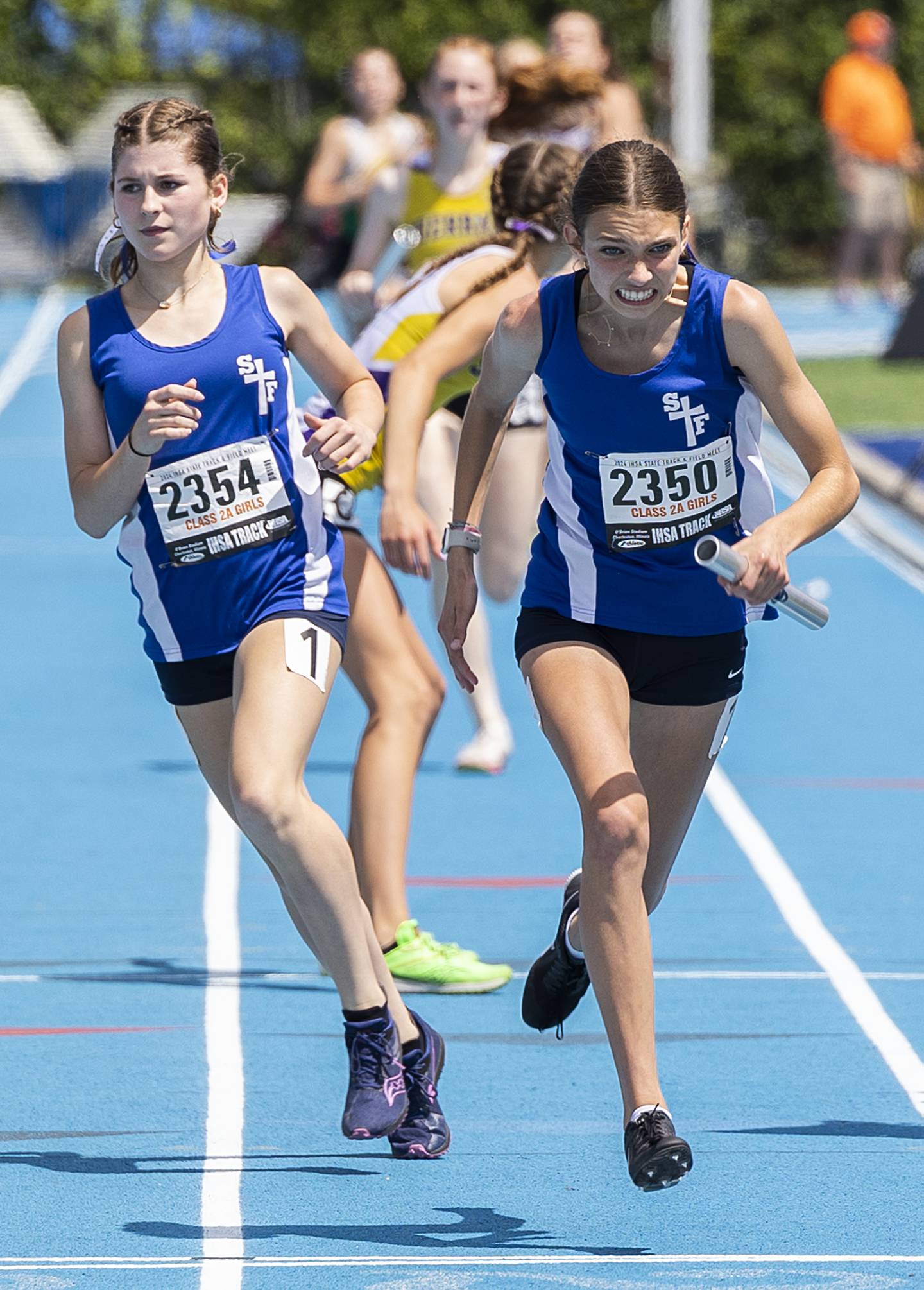 St. Francis’ Margaret Andrzekewski starts her leg of the race in the 2A 4x800 Saturday, May 18, 2024 at the IHSA girls state track meet in Charleston.