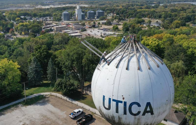 Crews are in the beginning stages of painting the Utica water towner on top of Clarks Hill on Wednesday, Sept. 18, 2024 in Utica. Crews will be doing repairs to the interior and exterior of the tower before painting. When finished, the tower will have a new logo on it.