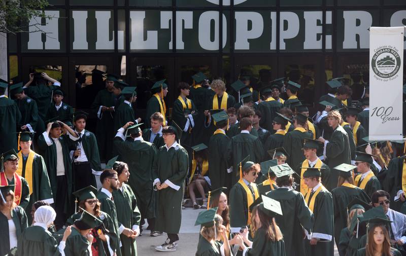 Students gather outside the gym entrance prior to the start of the Glenbard West graduation ceremony on Thursday, May 23, 2024 in Glen Ellyn.