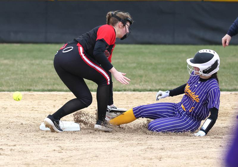 Mendota's Ava Eddy slides in safely with a stolen base as the ball gets by Indian Creek’s Bella Klotz during their game Thursday, March 14, 2024, at Indian Creek High School in Shabbona.