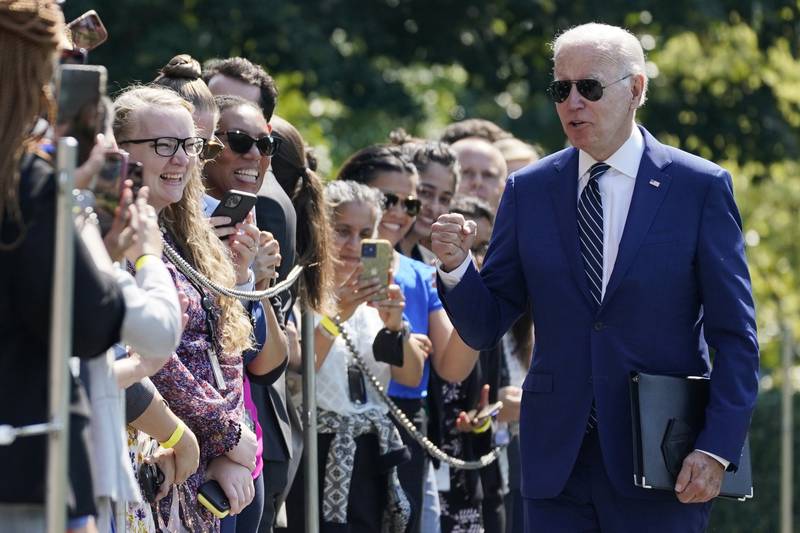 President Joe Biden greets people after returning to the White House in Washington, Wednesday, Aug. 24, 2022. Biden and his family spent time in Delaware for summer vacation. (AP Photo/Evan Vucci)