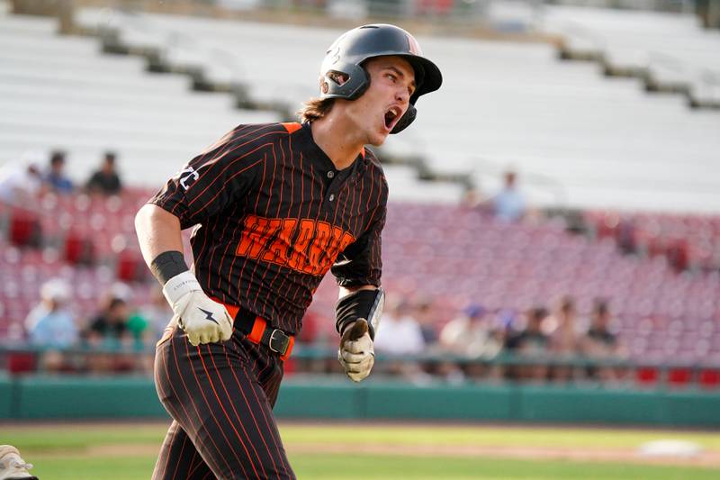 McHenry's Kyle Maness (15) reacts after hitting a single against York during a class 4A Kane County supersectional baseball game at Northwestern Medicine Field in Geneva on Monday, June 3, 2024.