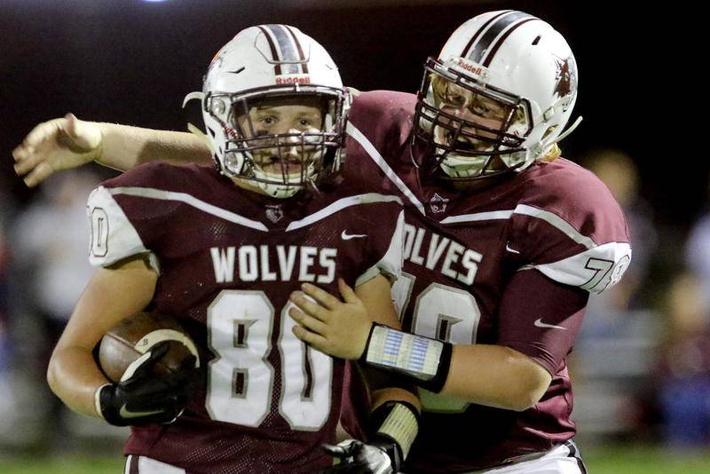 Prairie Ridge's Tim Maguire celebrates with teammate Brett Nygren during Friday's game against Huntley in Crystal Lake.