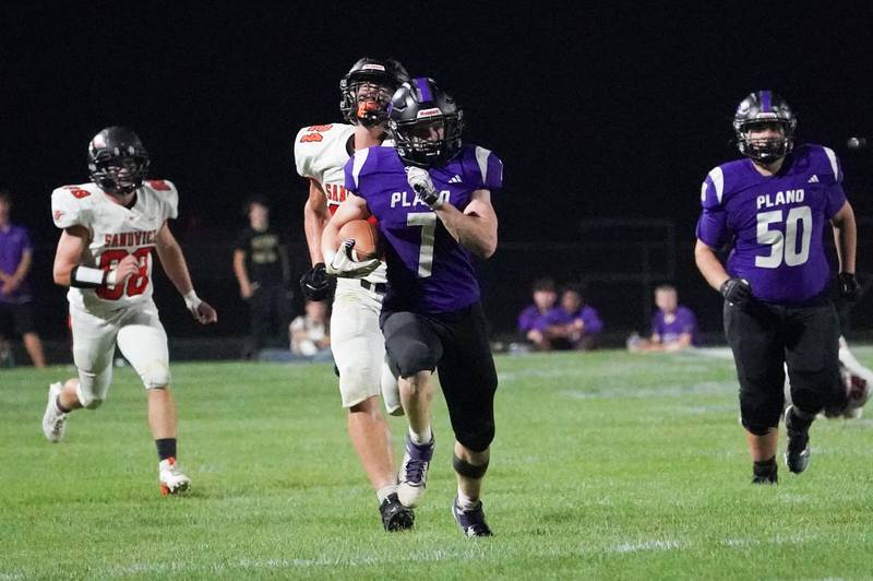 Plano’s Tim Young (7) carries the ball against Sandwich during a football game at Plano High School on Friday, Sep 13, 2024.