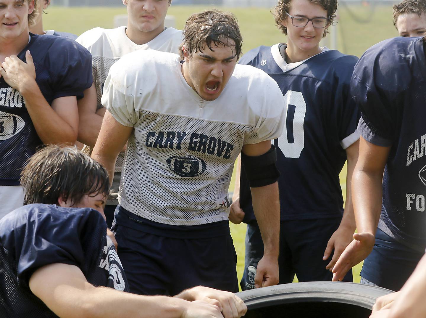 Cary-Grove’s Will Barcy cheers on his teammates during football practice Thursday, June 29, 2023, at Cary-Grove High School in Cary.