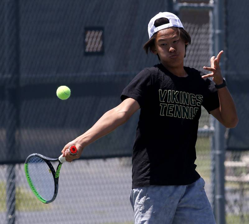 Fremd's Stanley Zeng returns the ball during an IHSA 2A boys doubles tennis match Thursday, May 25, 2023, at Buffalo Grove High School.