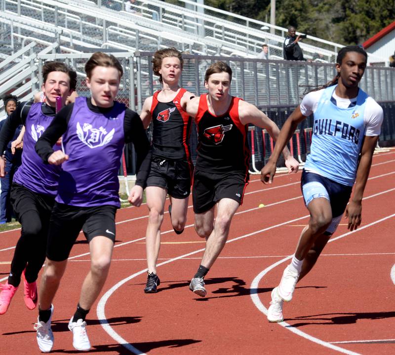 Forreston-Polo's Brock Soltow (center) gets the baton from Brody Schwartz in the 4x100 relay at the 44th Annual Gebhardt-Worley Invitational on Saturday, April 6, 2024 at Landers-Loomis Field in Oregon.