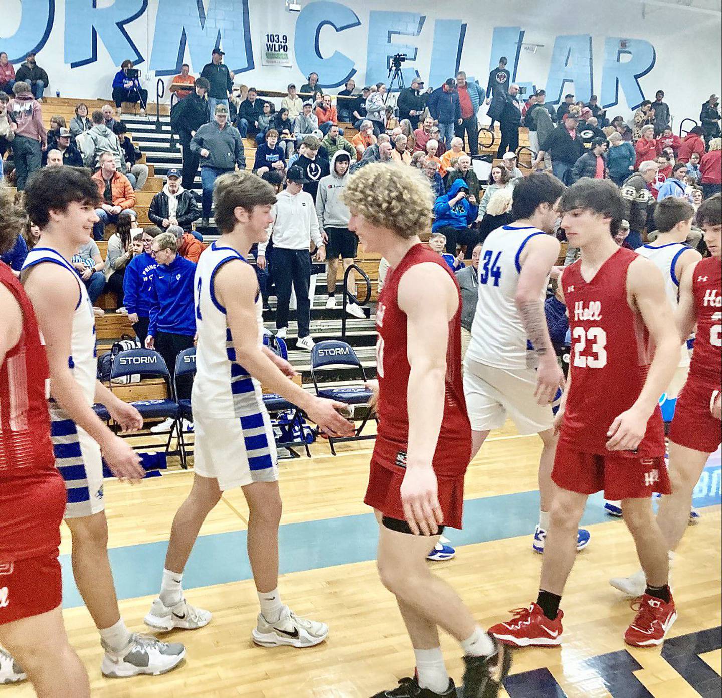 Princeton's Teegan Davis and Hall's Mac Resetich met after their regional basketball game at Bureau Valley. They made history as the first duo from Bureau County to sign to play Big Ten football, Davis with Iowa and Resetich for Illinois.