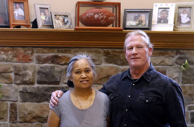 McHenry County deputy Khalia Satkiewicz with her husband, retired Illinois State Police officer Robert Satkiewicz, at in their home in Spring Grove, on April 2, 2024.