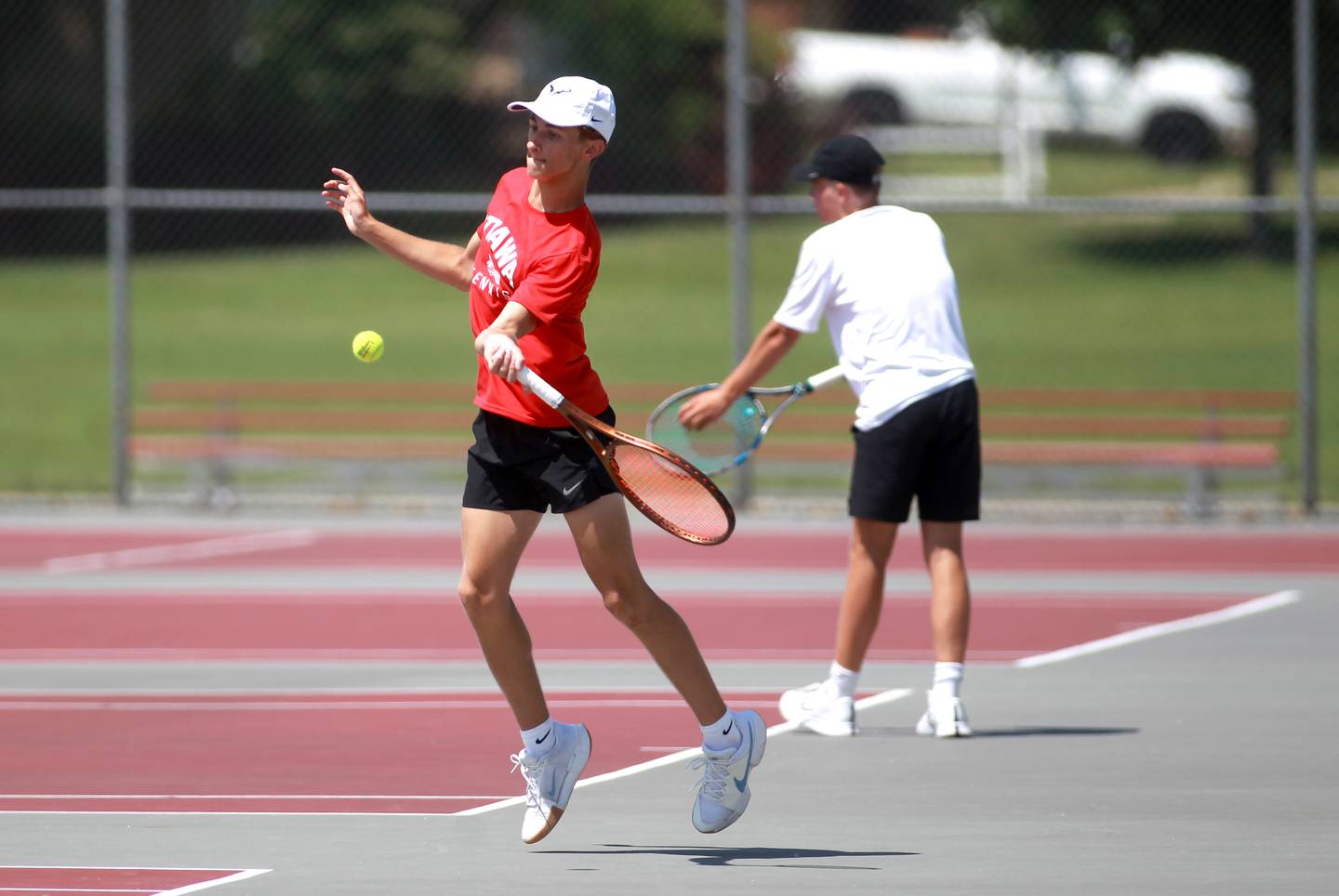 Ottawa’s Evan Krafft returns the ball during a doubles match with partner Alan Sifuentes (not pictured) in the state championship preliminaries at Palatine High School on Thursday, May 23, 2024.
