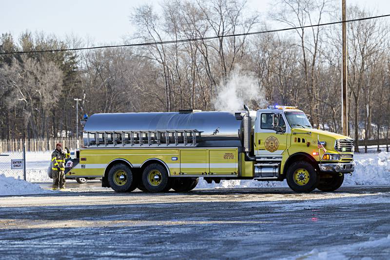 Local departments gather at East Coloma-Nelson school to fill up on water from the hydrants Tuesday, Jan. 16, 2024.