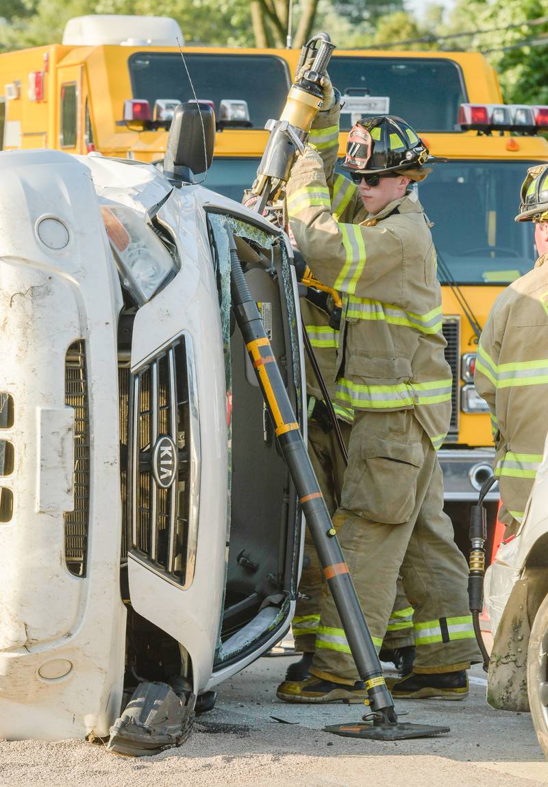 Elburn Firefighters demonstrate extricating a victim from a serious auto accident during the Campton Hills National Night Out event on Tuesday, August 2, 2022.