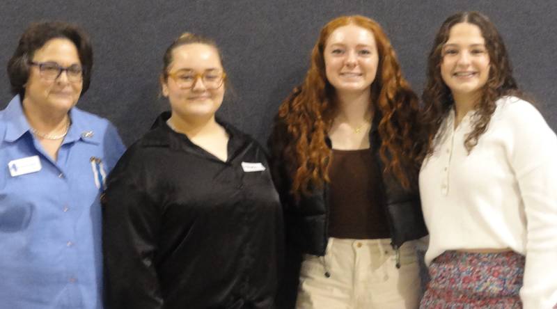 Donna Jungnickel congratulates Daughters of the American Revolution Good Citizen Award winners Makaela Lockwood, Addison Duttlinger and Madalyn Becker. Unable to attend was Chesney Auter.