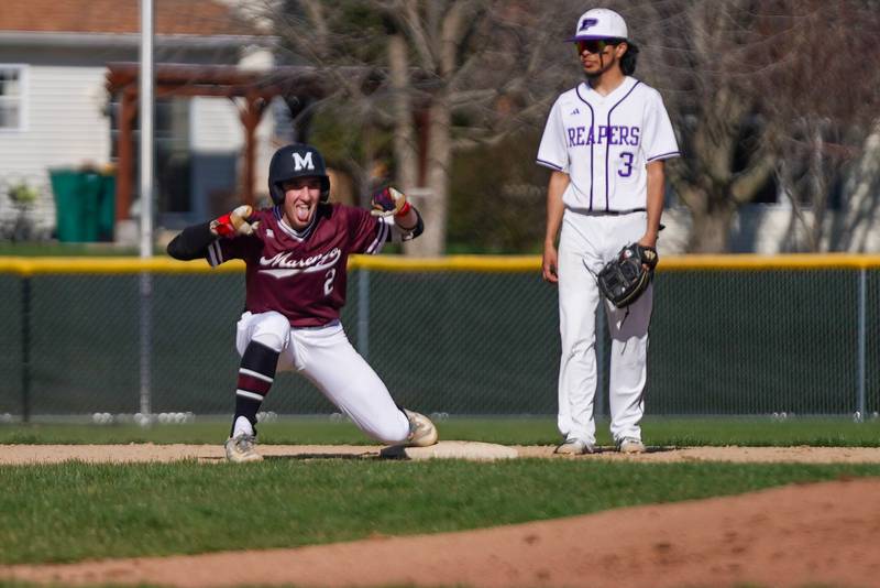 Marengo's Robert Heuser (2) reacts after reaching second base against Plano during a baseball game at Plano High School on Monday, April 8, 2024.