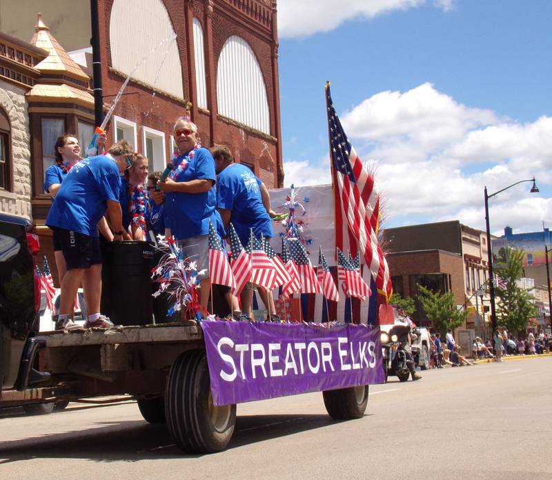 The Streator Elks Club squirts water guns at parade spectators Sunday, June 30, 2024, during the Liberty Fest parade in Streator.